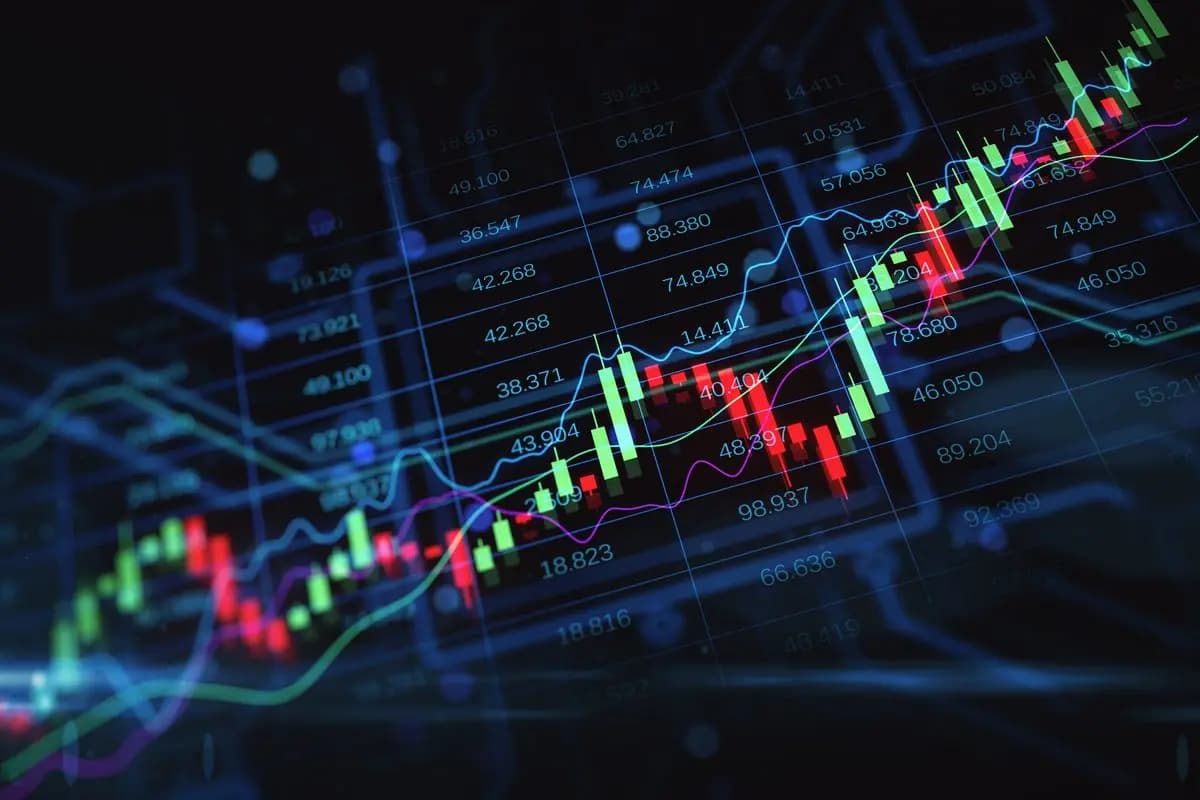 Financial analysts reviewing market performance data on screens